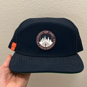 Never worn Melin hat - Country Club Crest. Navy / Orange / White.